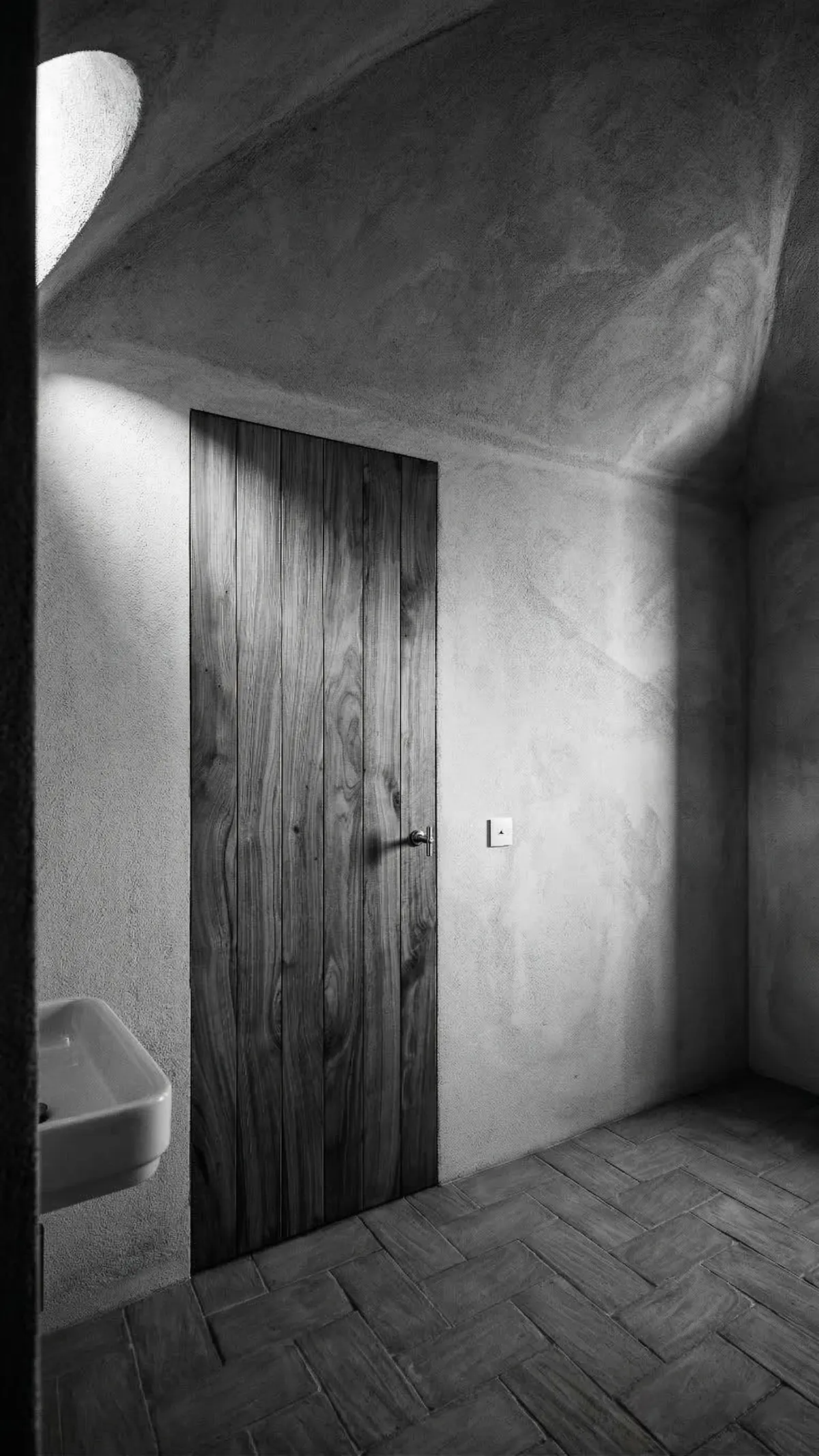 Porta interna minimale filomuro in castagno massello, ambiente rustico con volta intonacata e pavimento in cotto